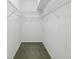 Walk-in closet with wire shelving and carpet flooring at 7427 Wimpole Dr # 7427, New Port Richey, FL 34655