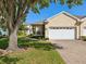 Charming single-story home with a well-maintained lawn and a two-car garage at 7427 Wimpole Dr # 7427, New Port Richey, FL 34655