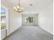 Bright living room with a large window that offers great natural light and space at 7427 Wimpole Dr # 7427, New Port Richey, FL 34655