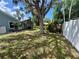 Enjoy the spacious backyard with mature trees providing shade; serene and private for outdoor enjoyment at 7444 Candlelight Ct, New Port Richey, FL 34652