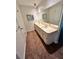 Bathroom with a double sink vanity at 7444 Candlelight Ct, New Port Richey, FL 34652