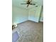 A bedroom featuring neutral carpet, a ceiling fan, and a closet, ready for personalization at 7444 Candlelight Ct, New Port Richey, FL 34652