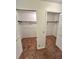 Walk in closets with white doors and carpet flooring at 7444 Candlelight Ct, New Port Richey, FL 34652