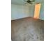 Spacious living room with neutral paint, carpet and a ceiling fan at 7444 Candlelight Ct, New Port Richey, FL 34652