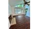 Bright living room with vaulted ceilings, wood floors, and a cozy fireplace at 7444 Candlelight Ct, New Port Richey, FL 34652