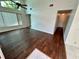 Spacious living room with wood floors, neutral walls, and ample natural light at 7444 Candlelight Ct, New Port Richey, FL 34652