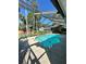 A screened in pool, surrounded by a patio and lush greenery, is perfect for outdoor relaxation at 7444 Candlelight Ct, New Port Richey, FL 34652