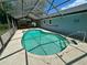 Relax in this refreshing pool enclosed by a screen, a perfect outdoor oasis for entertainment or unwinding at 7444 Candlelight Ct, New Port Richey, FL 34652