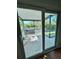 A screened porch is visible through a sliding glass door, leading to outdoor enjoyment at 7444 Candlelight Ct, New Port Richey, FL 34652