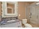 Bathroom with mosaic tile shower and updated vanity with marble counter at 8516 Wooddrift Dr, Tampa, FL 33615