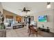 Spacious bedroom with open closet, large windows, ceiling fan, and entertainment center at 8516 Wooddrift Dr, Tampa, FL 33615