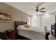 A comfortable bedroom with hardwood floors and updated ceiling fan features generous closet space at 8516 Wooddrift Dr, Tampa, FL 33615