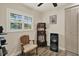 Bedroom with wood-look floors, window with shutters and a vintage-style sound system at 8516 Wooddrift Dr, Tampa, FL 33615