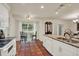 Bright kitchen featuring breakfast nook with table, chandelier and tiled floors at 8516 Wooddrift Dr, Tampa, FL 33615