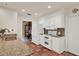 Bright kitchen featuring white appliances, cabinets, granite countertops and tiled floor at 8516 Wooddrift Dr, Tampa, FL 33615