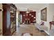 Cozy living room with a wooden fireplace, display cabinets, and decorative touches at 8516 Wooddrift Dr, Tampa, FL 33615
