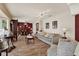 Comfortable living room featuring wood floors, stylish seating, a fireplace, and elegant decor at 8516 Wooddrift Dr, Tampa, FL 33615