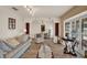 Spacious living room with wood floors, stylish furniture, and elegant archways with columns at 8516 Wooddrift Dr, Tampa, FL 33615