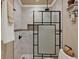 This bathroom features a modern glass shower with stylish tile and shower head, plus unique shelving at 8516 Wooddrift Dr, Tampa, FL 33615