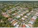 Expansive aerial view of a residential community showcasing well-maintained homes and landscaping at 9398 Mississippi Run, Weeki Wachee, FL 34613