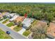 Aerial view shows the home's location, driveway, and surrounding landscape at 9398 Mississippi Run, Weeki Wachee, FL 34613