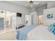 Bedroom with slider doors, walk in closet, and en suite bathroom at 9398 Mississippi Run, Weeki Wachee, FL 34613