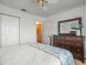 This bedroom offers ample storage space with a spacious dresser and closet at 9398 Mississippi Run, Weeki Wachee, FL 34613
