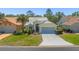Charming single-story home with a well-manicured front yard, mature landscaping, and a two-car garage at 9398 Mississippi Run, Weeki Wachee, FL 34613
