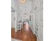 Inviting hallway with hardwood floors, high ceilings, and an open view into the living spaces beyond at 9398 Mississippi Run, Weeki Wachee, FL 34613