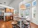 Open kitchen area with center island and seating, lots of natural light at 9398 Mississippi Run, Weeki Wachee, FL 34613