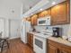 Efficient kitchen with essential appliances, ample counter space, and easy access to nearby amenities at 9398 Mississippi Run, Weeki Wachee, FL 34613