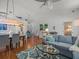 Spacious living area with a sofa, dining table, and open access to other rooms for a seamless flow at 9398 Mississippi Run, Weeki Wachee, FL 34613
