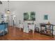 Open-concept living space with a desk, a stylish bar cart, and seamless access to other rooms in the home at 9398 Mississippi Run, Weeki Wachee, FL 34613