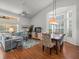 Bright living space with a comfortable seating area, large windows, and dining space that creates an inviting atmosphere at 9398 Mississippi Run, Weeki Wachee, FL 34613