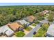 Charming street view featuring well-kept homes with mature trees, and manicured lawns at 9398 Mississippi Run, Weeki Wachee, FL 34613