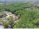 Expansive aerial view of a property nestled amongst lush green trees at 10134 Buck Dr, New Port Richey, FL 34654