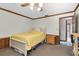 Bedroom with ceiling fan, natural light, and wood trim at 10134 Buck Dr, New Port Richey, FL 34654