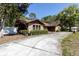 Brick accent home with a well-maintained lawn and a spacious driveway at 10134 Buck Dr, New Port Richey, FL 34654