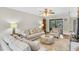 Comfortable living room with large windows providing natural light at 10134 Buck Dr, New Port Richey, FL 34654