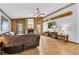 Bright living room features a brick fireplace, wood accents, and an adjacent entertainment center at 10134 Buck Dr, New Port Richey, FL 34654