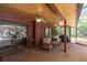 Covered patio with outdoor seating, fans, and views of pool and private backyard at 10134 Buck Dr, New Port Richey, FL 34654