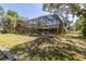 A screened pool with a slide and furniture in the backyard offers outdoor relaxation and recreation at 10134 Buck Dr, New Port Richey, FL 34654