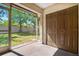Outdoor view of screened-in back porch area, perfect for relaxing and enjoying the green backyard at 10780 43Rd N St # 702, Clearwater, FL 33762