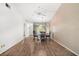 Bright dining room with hardwood floors, modern lighting fixture, and a ceiling fan at 10780 43Rd N St # 702, Clearwater, FL 33762