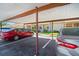 Exterior parking lot with covered spots for residents and guests at 10780 43Rd N St # 702, Clearwater, FL 33762