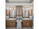 Double sink bathroom vanity with granite countertops and beautiful decorative mirrors at 10808 Alico Pass, New Port Richey, FL 34655