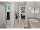 Bathroom featuring shower with curtain, granite counters, and a sink at 10808 Alico Pass, New Port Richey, FL 34655