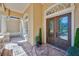 Stunning front entrance featuring a decorative glass door, stone accents, and manicured landscaping at 10808 Alico Pass, New Port Richey, FL 34655