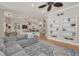 Open concept living area featuring built-in shelving and elegant hardwood flooring at 10808 Alico Pass, New Port Richey, FL 34655