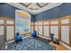 Spacious office showcases natural light, custom wall paneling, and a patterned rug at 10808 Alico Pass, New Port Richey, FL 34655